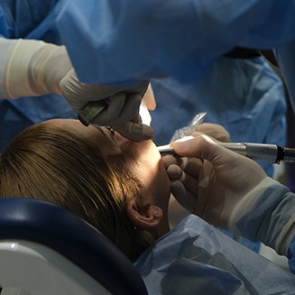 Dentist performing surgery