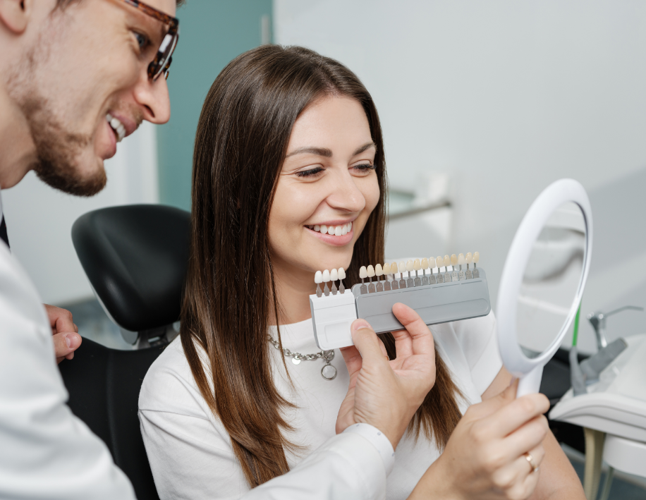 Dentist showing patient veneers